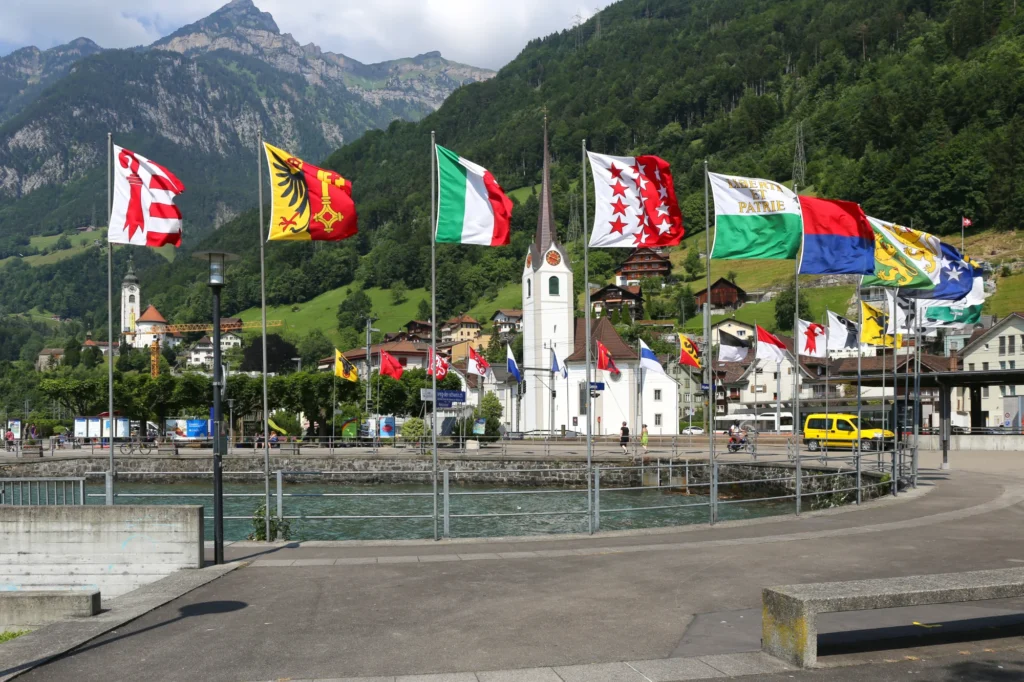Flüelen pier and railway station at the southern end of Lake Uri with mountains behind