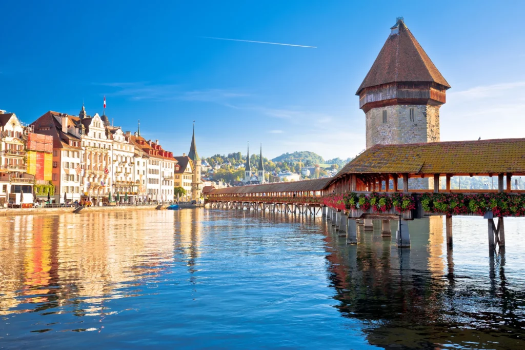 Chapel Bridge and Water Tower in Lucerne reflected in the Reuss