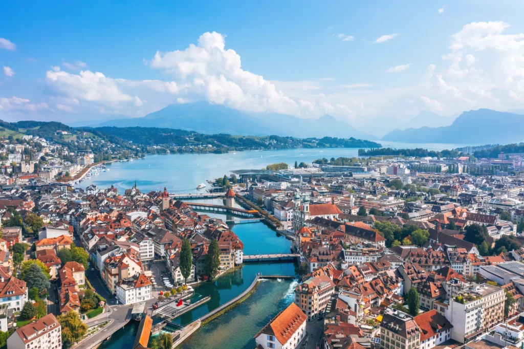 Lucerne old town and the Reuss river from above with the lake behind